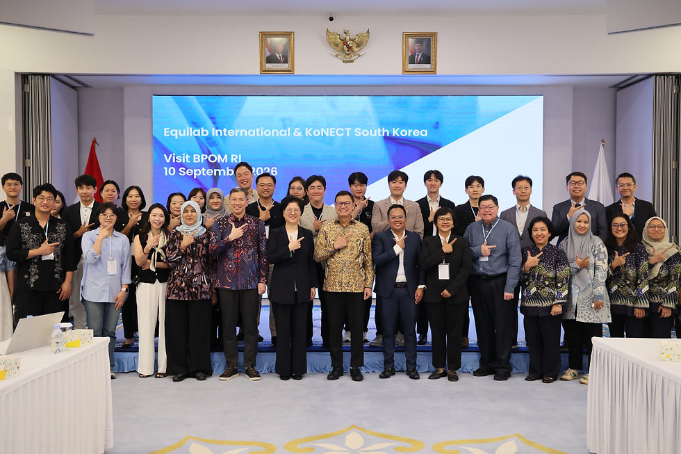 Large group of officials posing in a conference hall, pointing at the camera; screen reads Equilab International & KoNECT South Korea, Visit BPOM RI