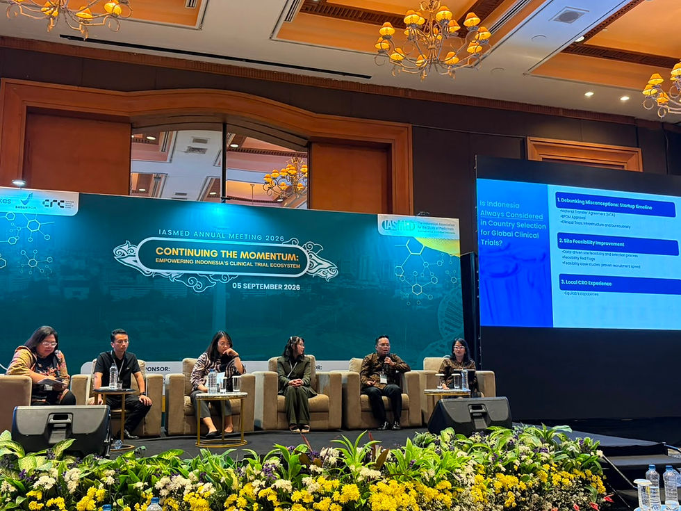 Panelists speak on stage at IASMED Annual Meeting 2026, Continuing the Momentum, with a slide on global clinical trials.